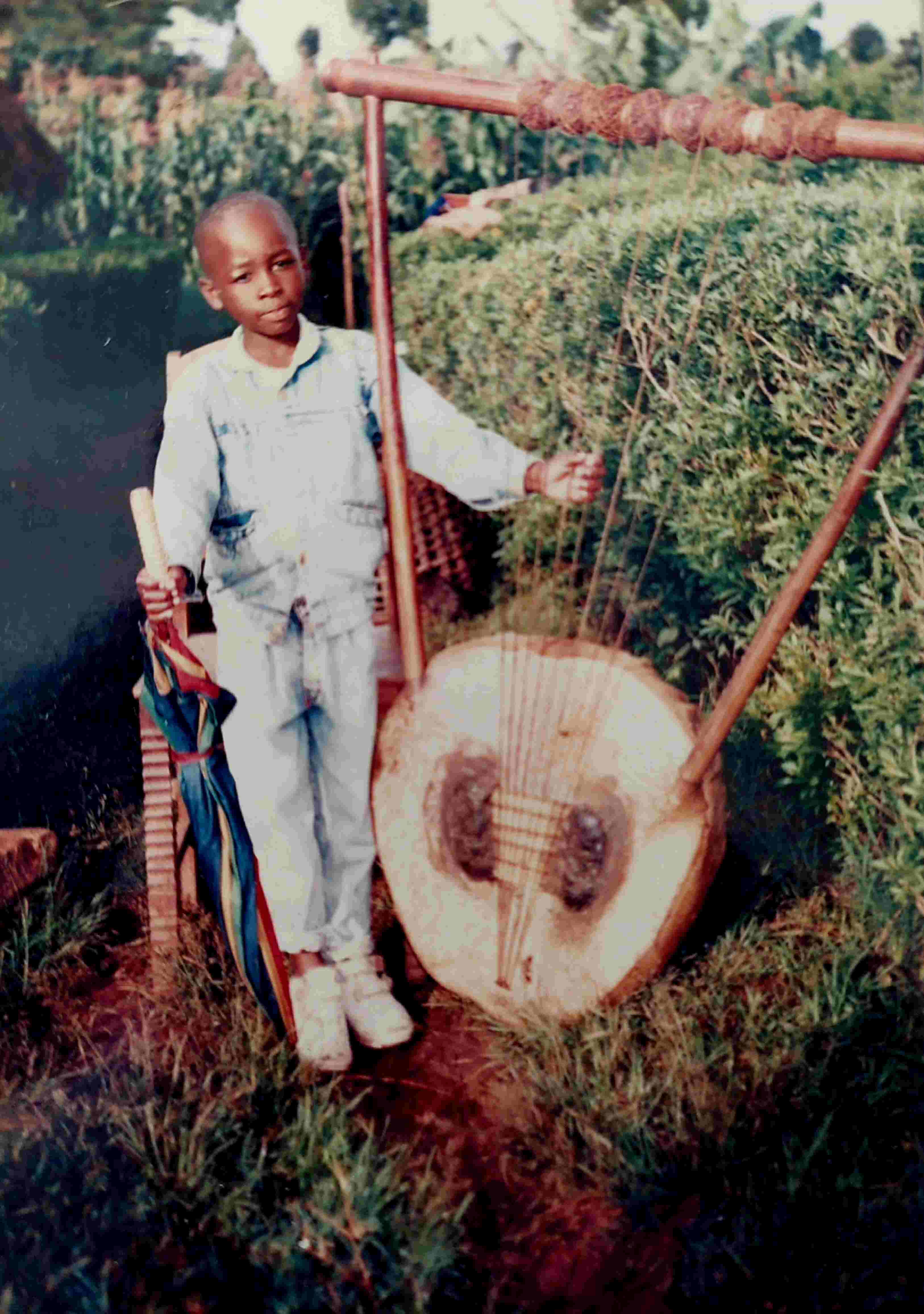 A picture of Masaki with a gusii instrument (Obokano).